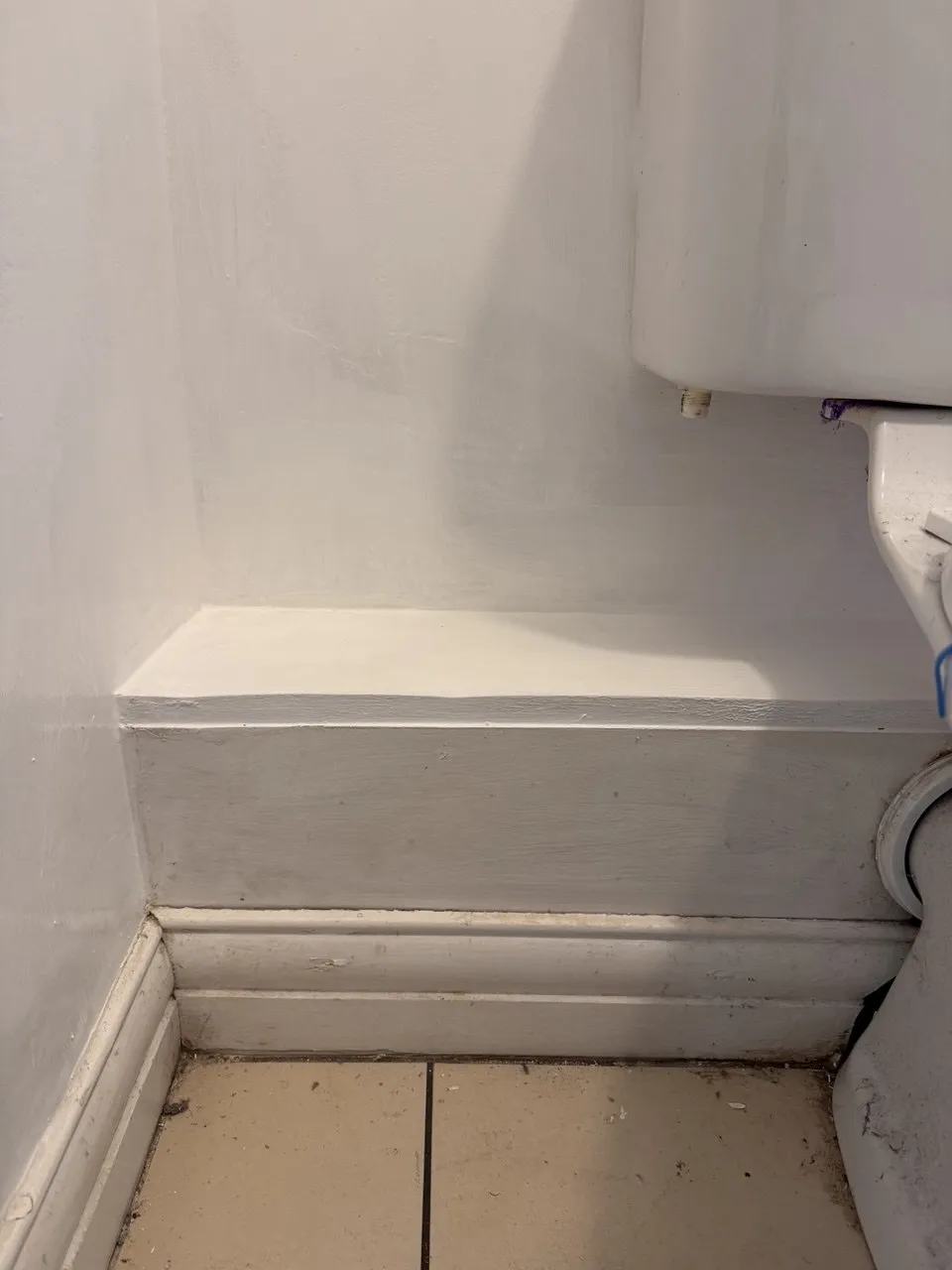 Stain treatment behind toilet